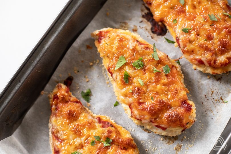 Cheese and tomato sauce baked chicken breasts