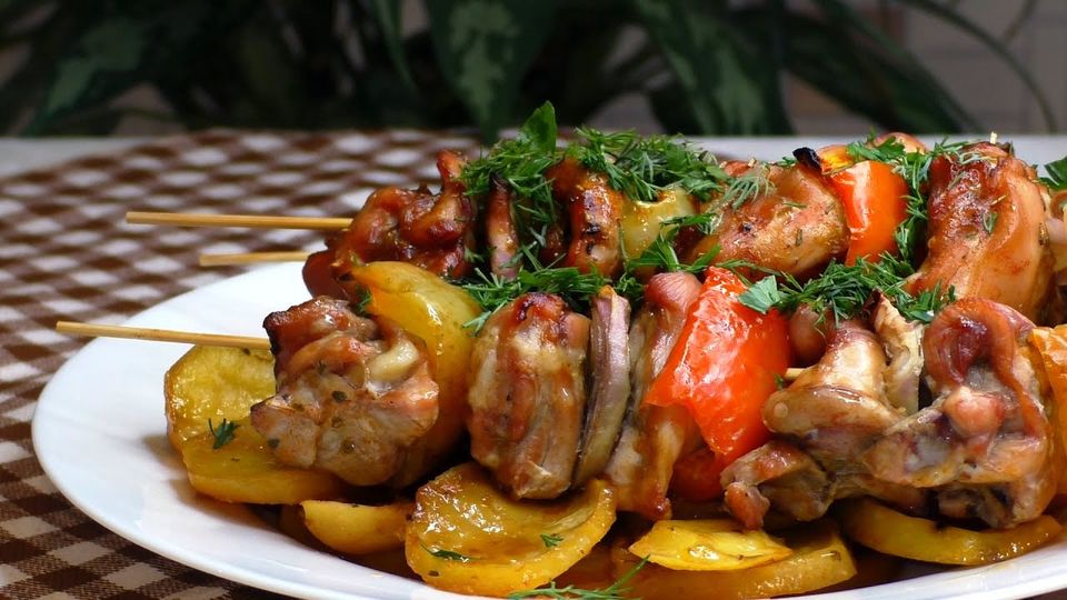 Traybake pork skewers with potatoes